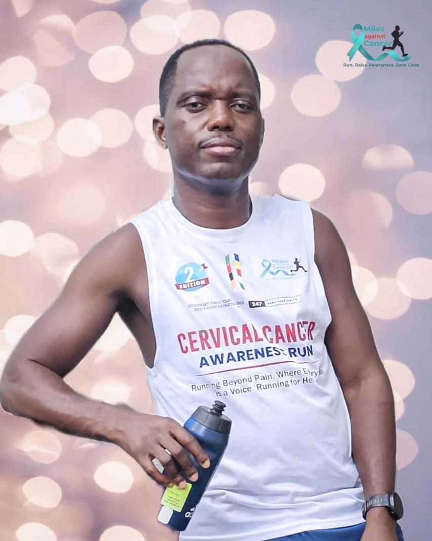 Miles Against Cancer Executive Director wearing the MAC Cervical Cancer Awareness Run vest